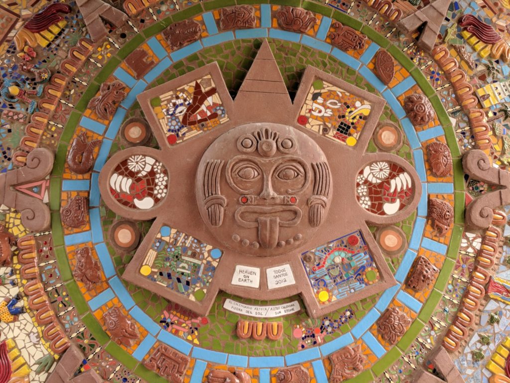 Aztec calendar mosaic in bright colors