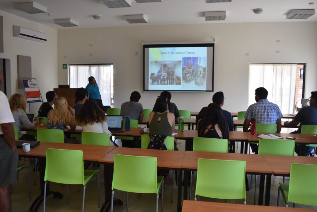 Students watch a presentation introducing them to the situation in Todos Santos.