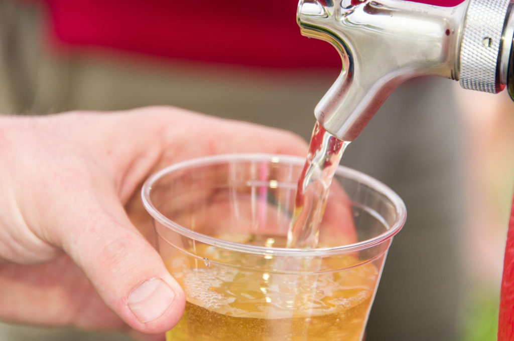 close up of beer being poured