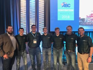 The CSU team stands in front of the ABC Spring 2018 Convention sign.
