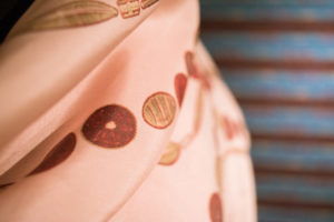 A close up shot of pink fabric with circular designs