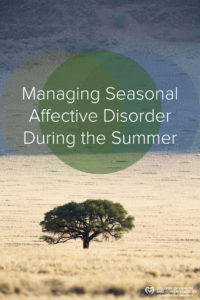 Lone tree in field. "Managing Seasonal Affective Disorder During the Summer."