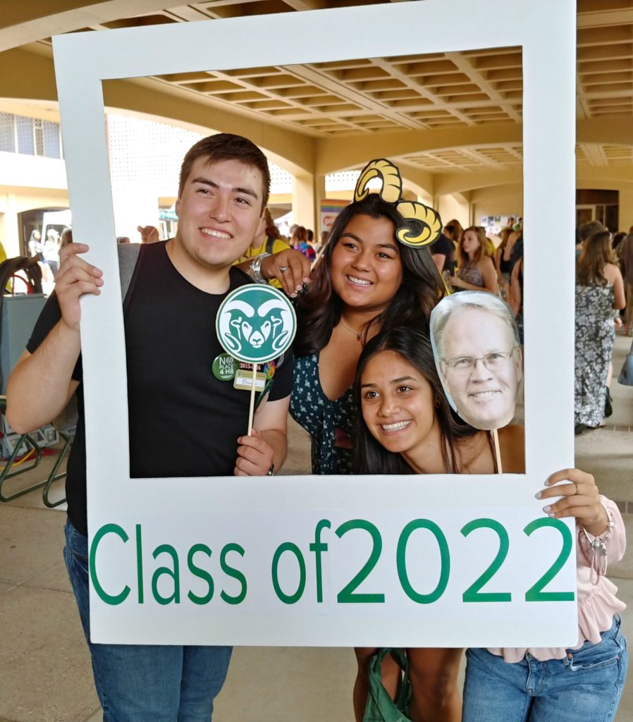 Students pose in the Class of 2020 photo booth polaroid board.