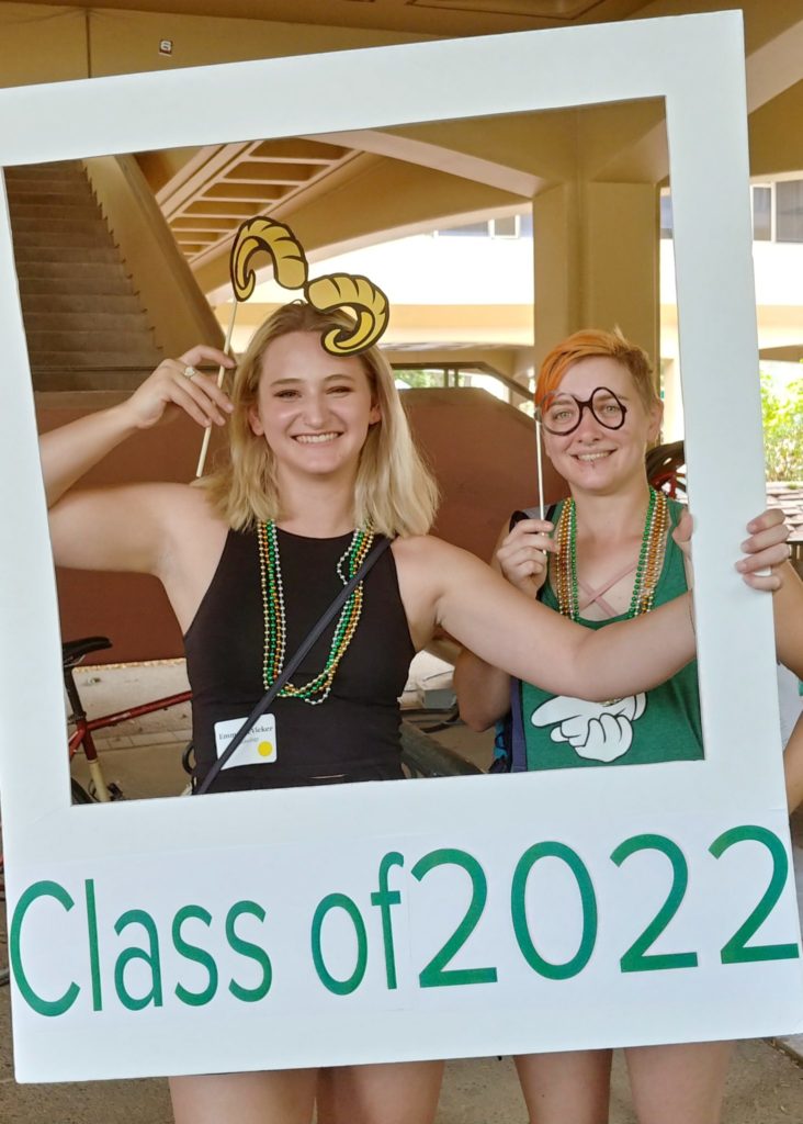 Students pose in the Class of 2020 photo booth polaroid board.