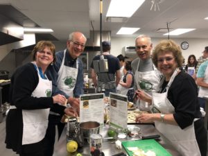 Four people attending a cooking class in the KRNC kitchens.