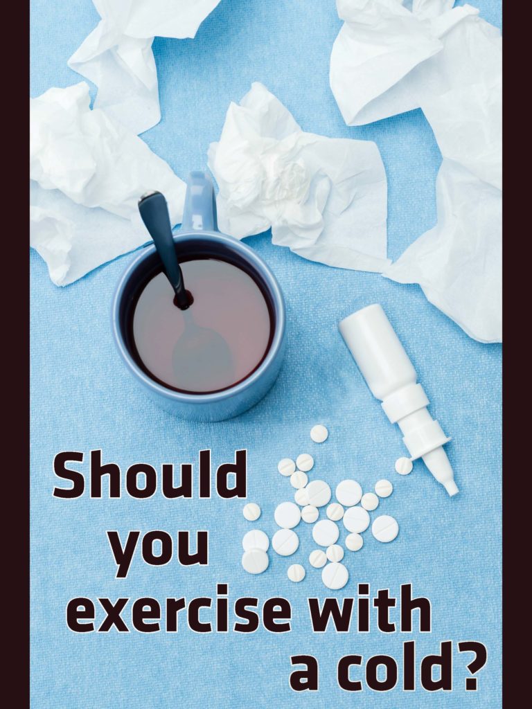Cold and illness medications, tea. tissues, and pills set out on a blue cloth surface. Text reads, "Should you exercise with a cold?"