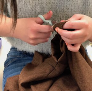 Student cutting cloth