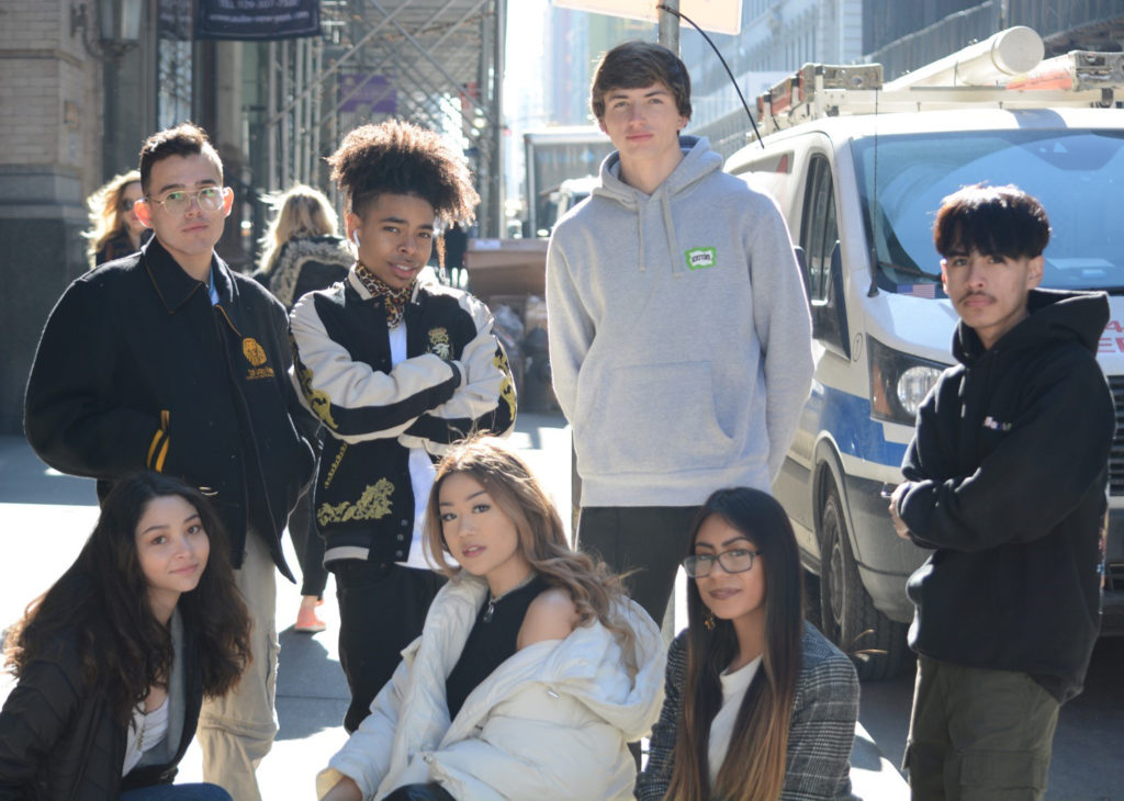 Outstanding grad Gio and friends pose on a New York City street.