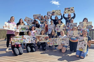Students in the mentoring program display their vision boards made during the mountain retreat in 2019.