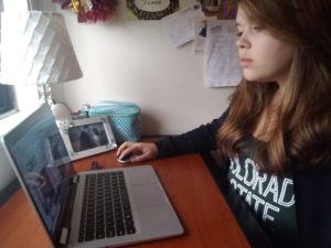 Tanea Lunzer working on homework at home during the COVID-19 pandemic