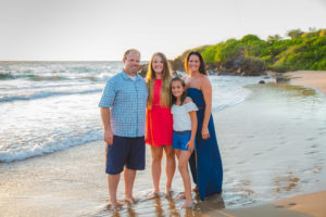Matt Blake and his family on a beach.