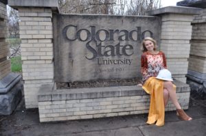 Abby Thiessen, CSU CM graduate with hardhat