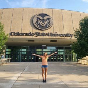 Sasha Colombo standing outside Moby arena under the words Colorado State University after deciding it would be her new home for 4 years