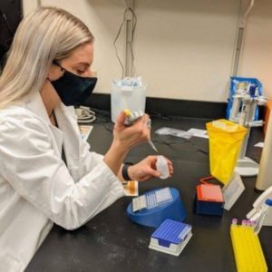 Kara McIver pipetting in a lab