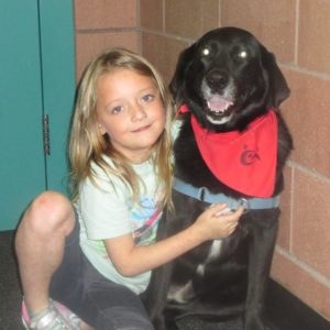 habic therapy dog lacy with a school student