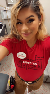 Vee Martinez smiles in her red target uniform