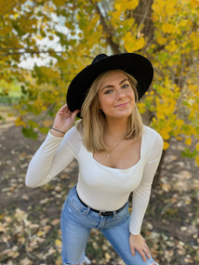 Kaitlin Dailey wearing a black hat