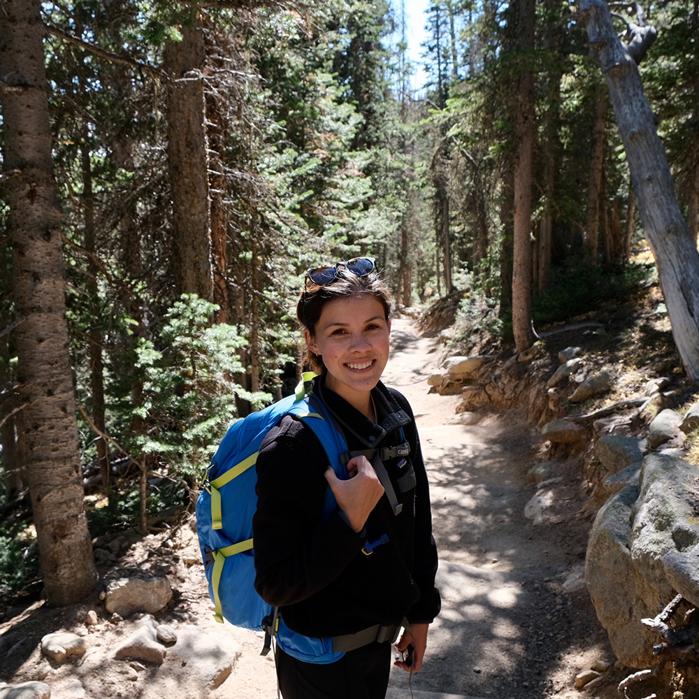 Kalena Giessler Gonzalez hiking in mountains