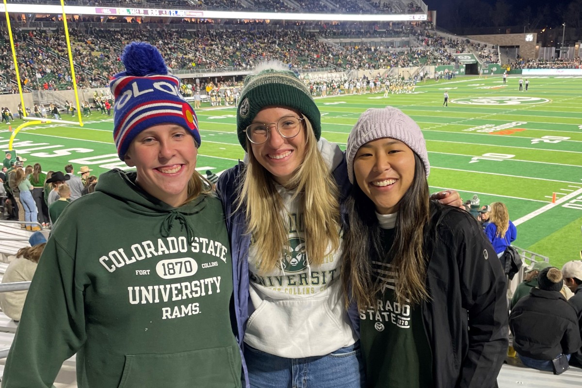 Kathrynn Hamada at a CSU football game with two friends