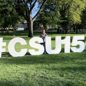 Donor Steph Hardon In Front Of CSU 150 Sign