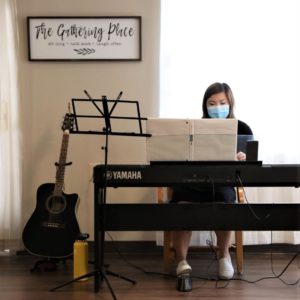 Gerontology Student Playing The Piano