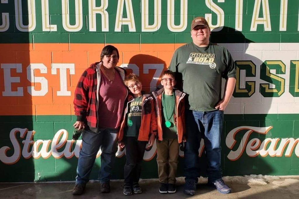 Loni at the CSU Stadium with her husband and two children