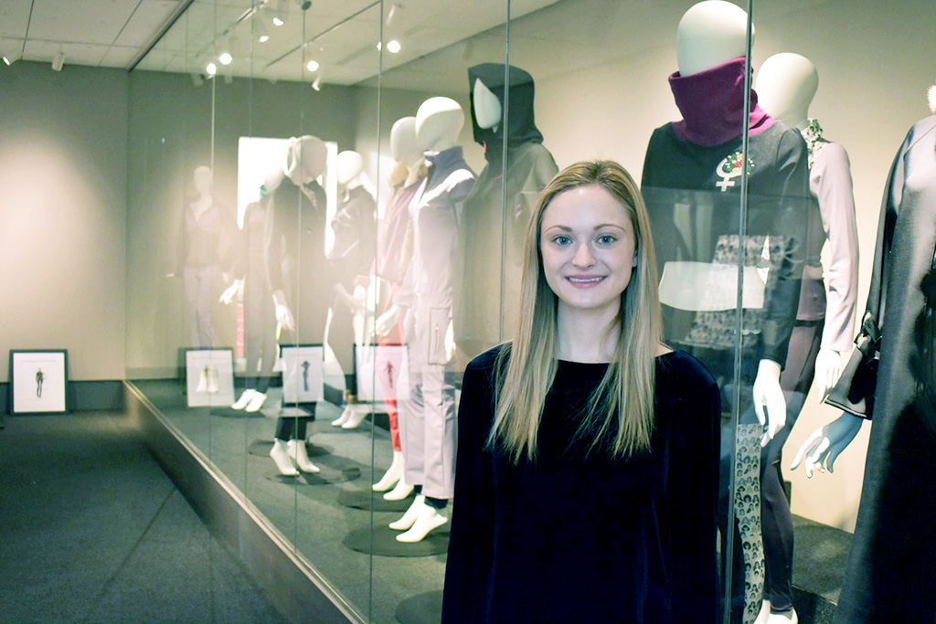Kate Schmidt stands in front of her 'Girl Powder' collection.