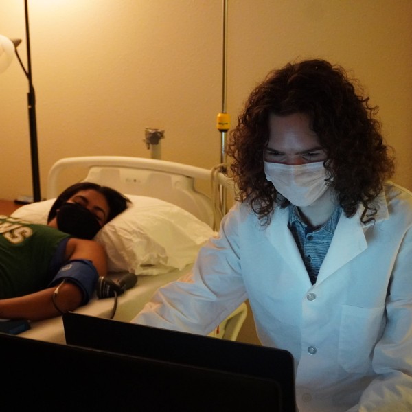 Brayden Smith conducting research with a patient