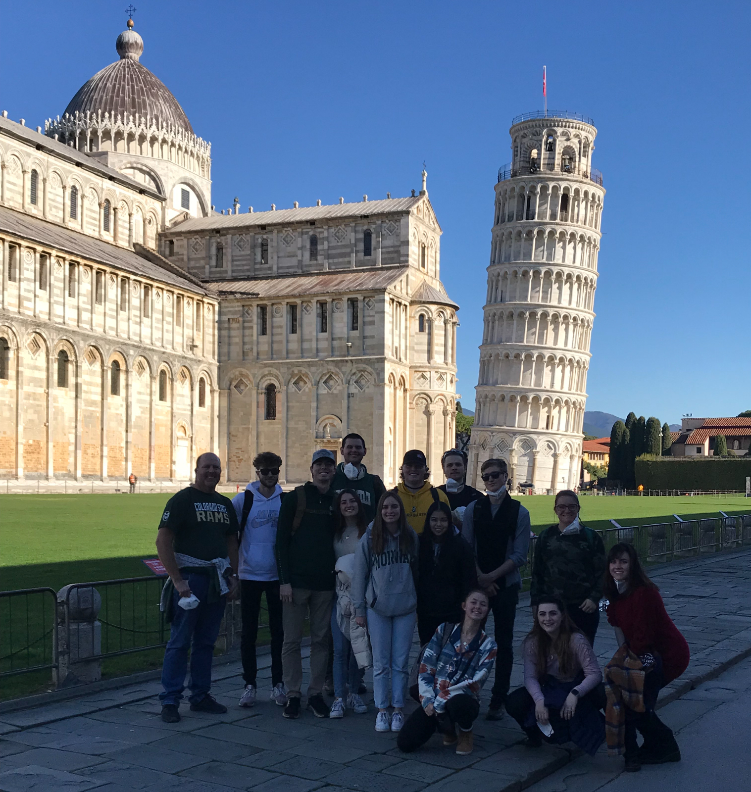 Study Abroad group posing in front of the Leaning Tower of Pisa, Italy