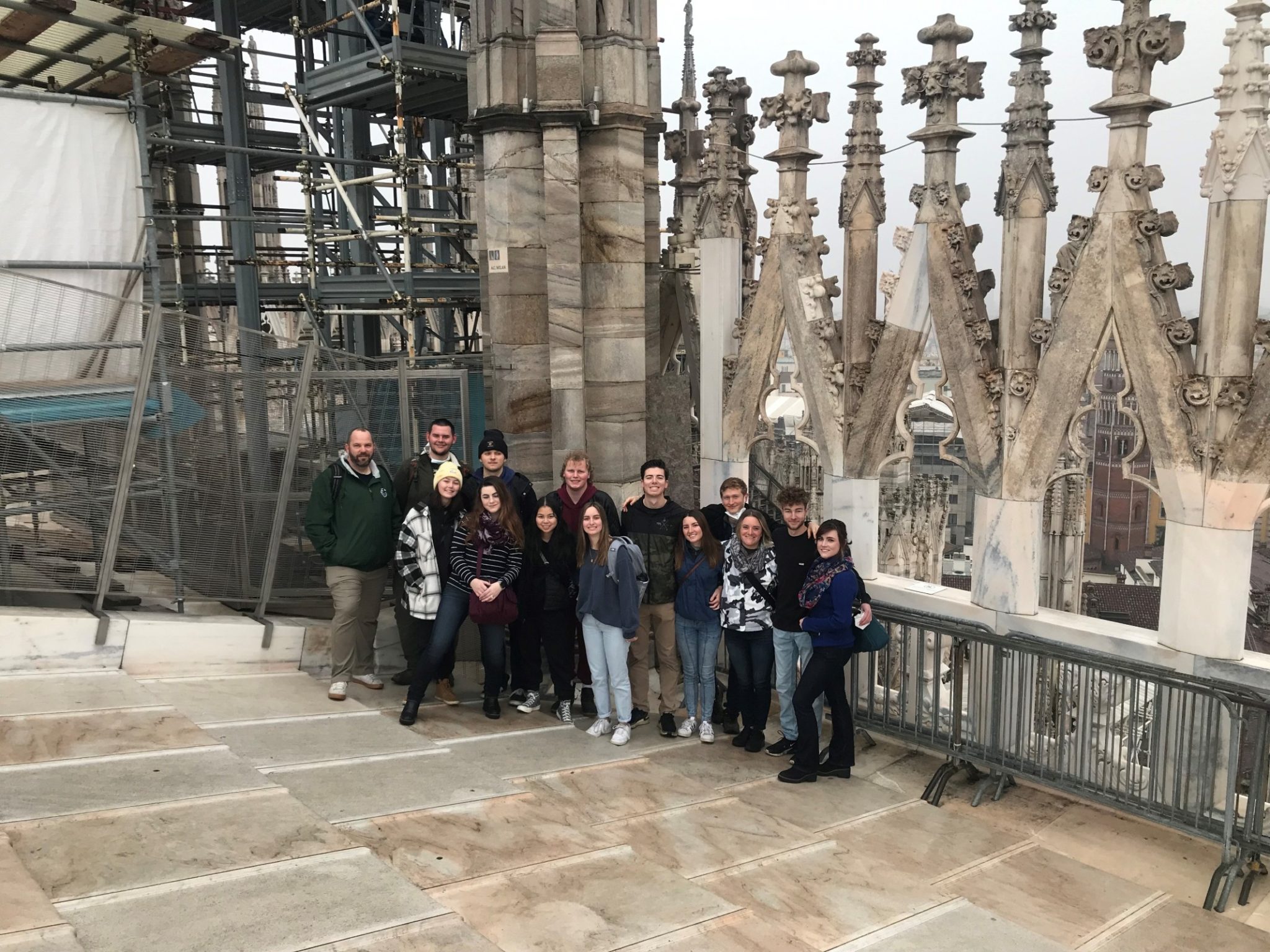 Study abroad students on rooftop at the renovation project of the Milan, Italy "Duomo" cathedral