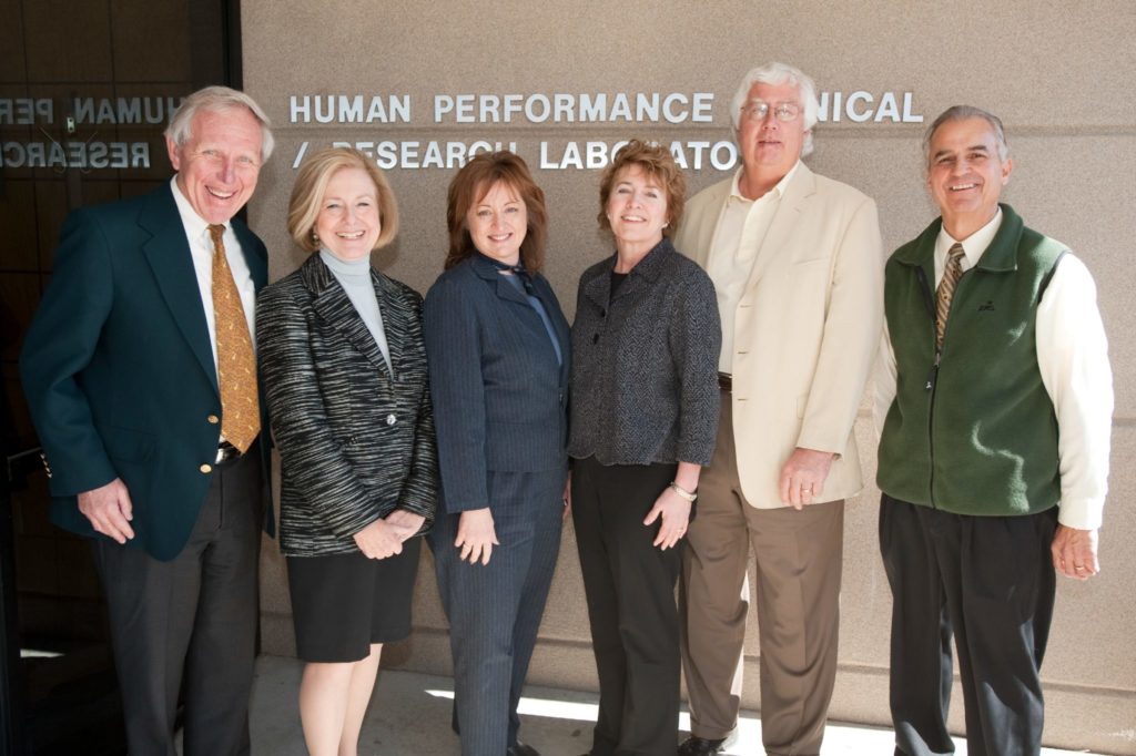 Faculty, staff, and donors pose in front of the Human Performance Clinical Research Laboratory