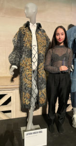 Latifah Hirchi-Vogl next to her design at the Metropolitan Museum of Art Costume Institute College Fashion Design Competition in New York City