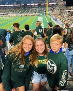 Cromwell and the kids she nannies for at a CSU football game
