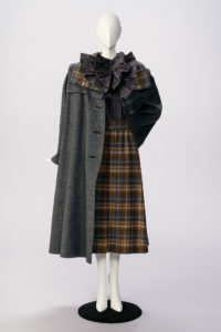 Plaid dress on a mannequin with a grey coat