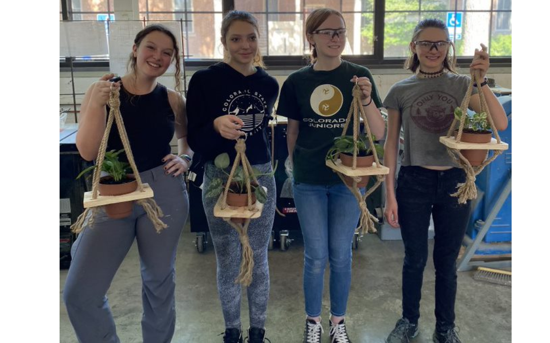 Women in Construction Management Summer Institute - 4 young women with their plant hanger projects