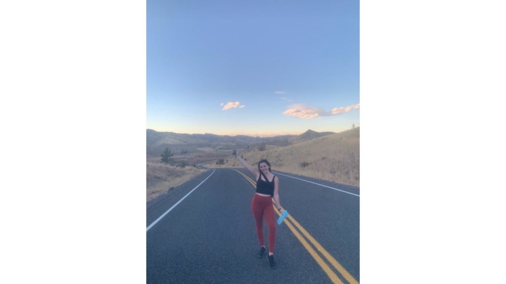 Eliza Venetis poses on a desert road in the early morning.