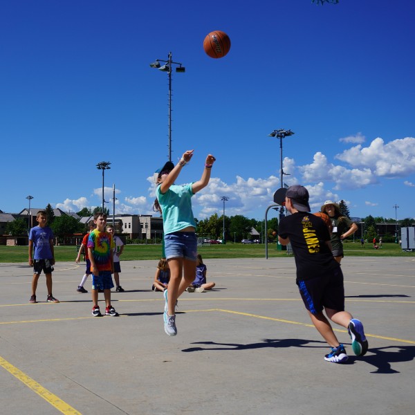 Youth Sport Camps attendees playing basketball