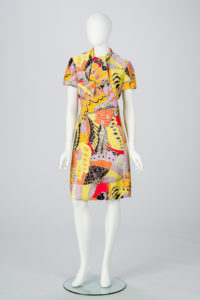 A colorful short dress with short sleeves on a mannequin