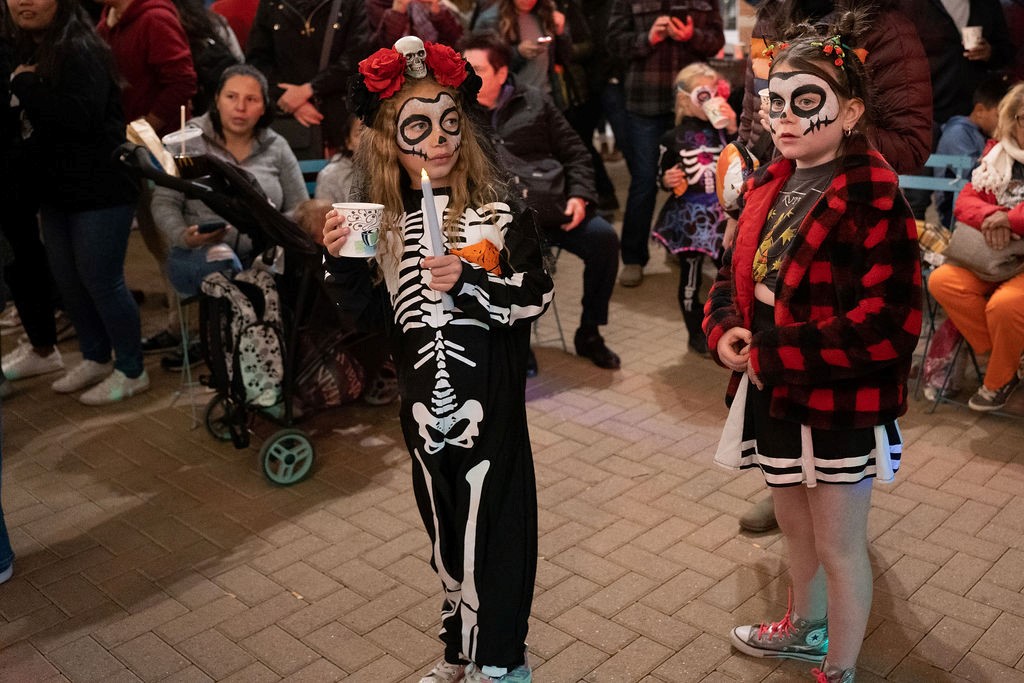 Two children dressed up for a Day of the Dead celebration