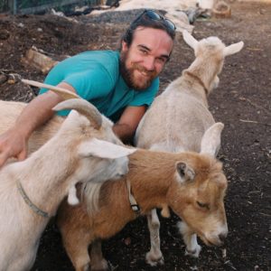 Adam Lovell outside with his goats