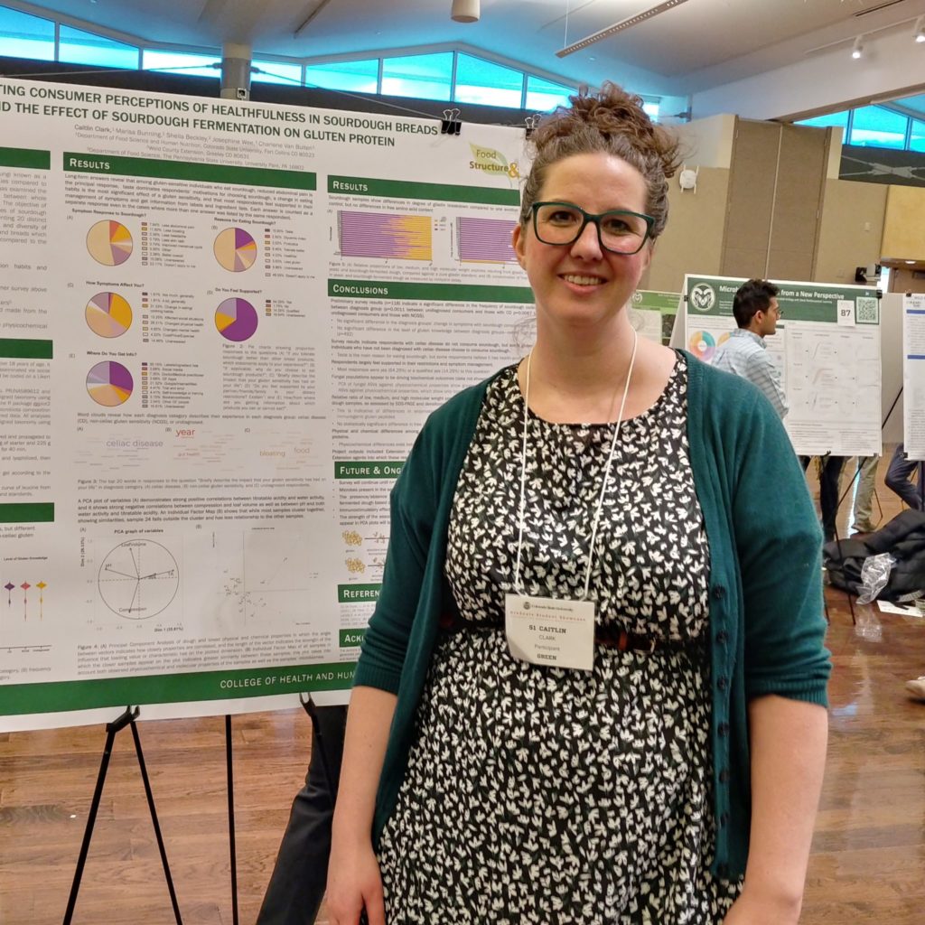 Caitlin Clark with her research poster. 