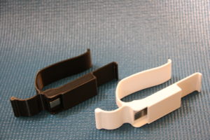 Two models of the MagnaCuff, one white and one black