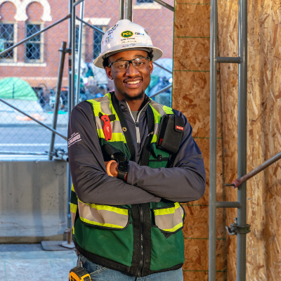 Dre Jackson posing on a construction site.