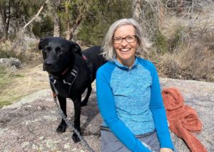 Jen Currin-McCulloch and her dog, Chica on a hike.