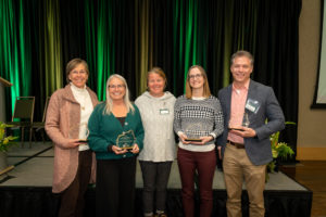 Award-winning faculty and alumni celebrate at an awards ceremony