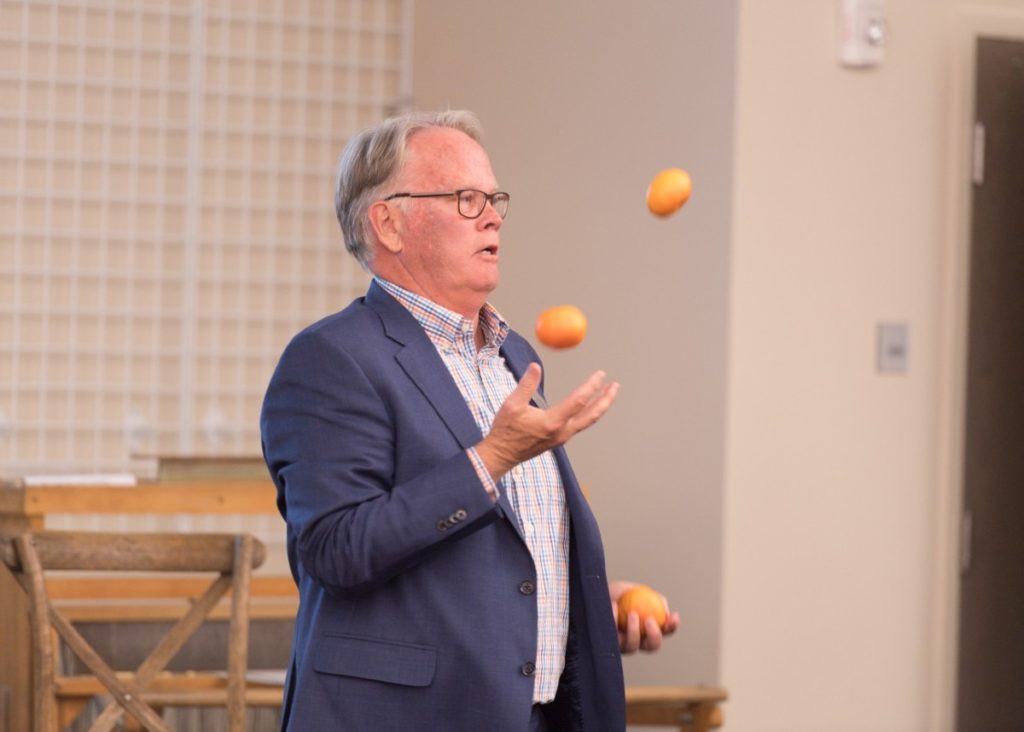 Jeff McCubbin juggling at the Legacy and Leaders reception, 2018