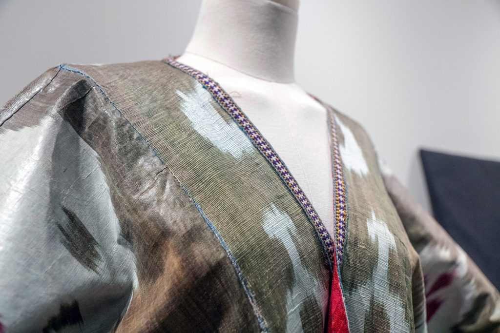 Snapshots: Six Curatorial Concepts includes a loose-fitting garment with a V-neck.