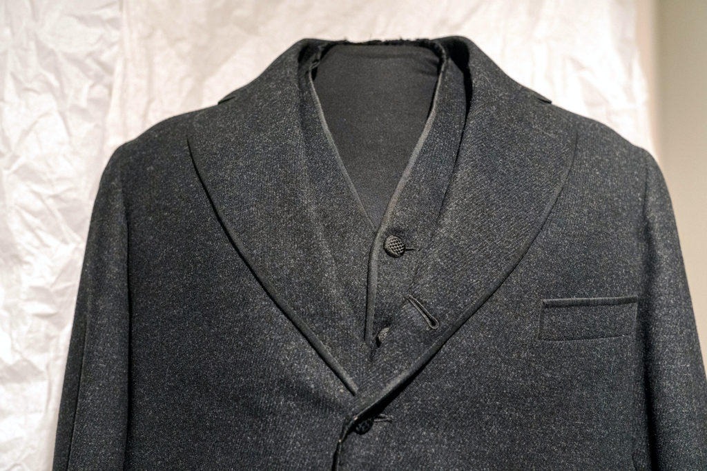 Snapshots: Six Curatorial Concepts includes a dark jacket and vest.