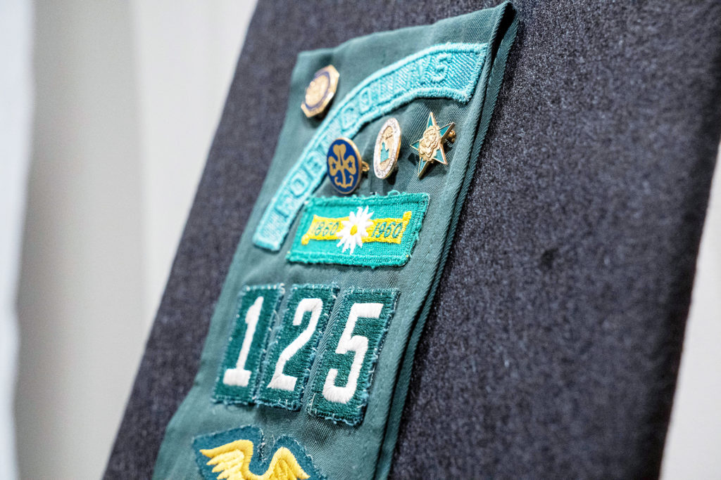Snapshots: Six Curatorial Concepts includes a garment that shows a patch with Fort Collins on it some buttons.