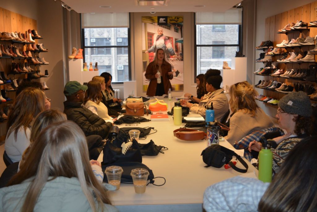 Students listen to Abbey Hume in the Sorel Showroom